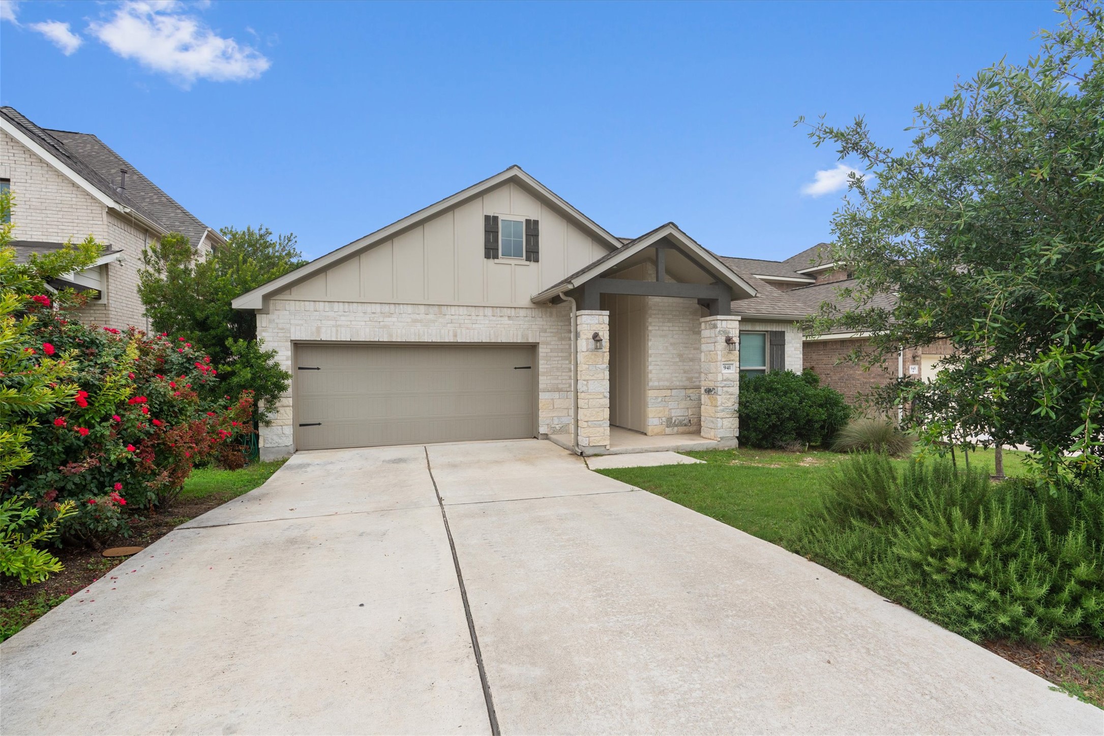 941 Del Raphael Drive Leander, TX 78641 - Photo 2 of 31 A long driveway and neat landscaping frame this Palmera Ridge home, setting a great tone before you even step inside