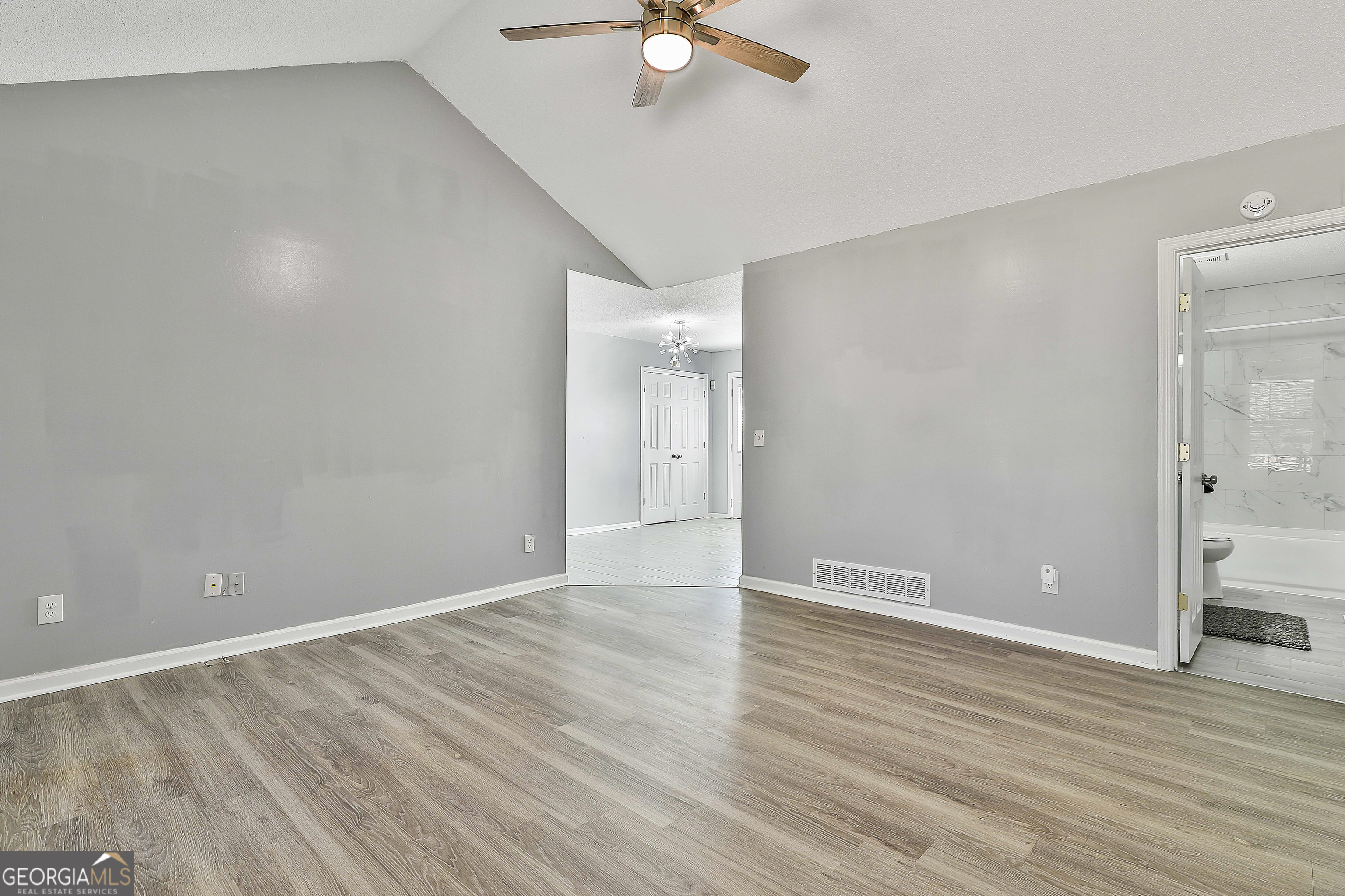 1209 North Hampton Drive Hampton, GA 30228 - Photo 11 of 39 wooden floor in an empty room with a window