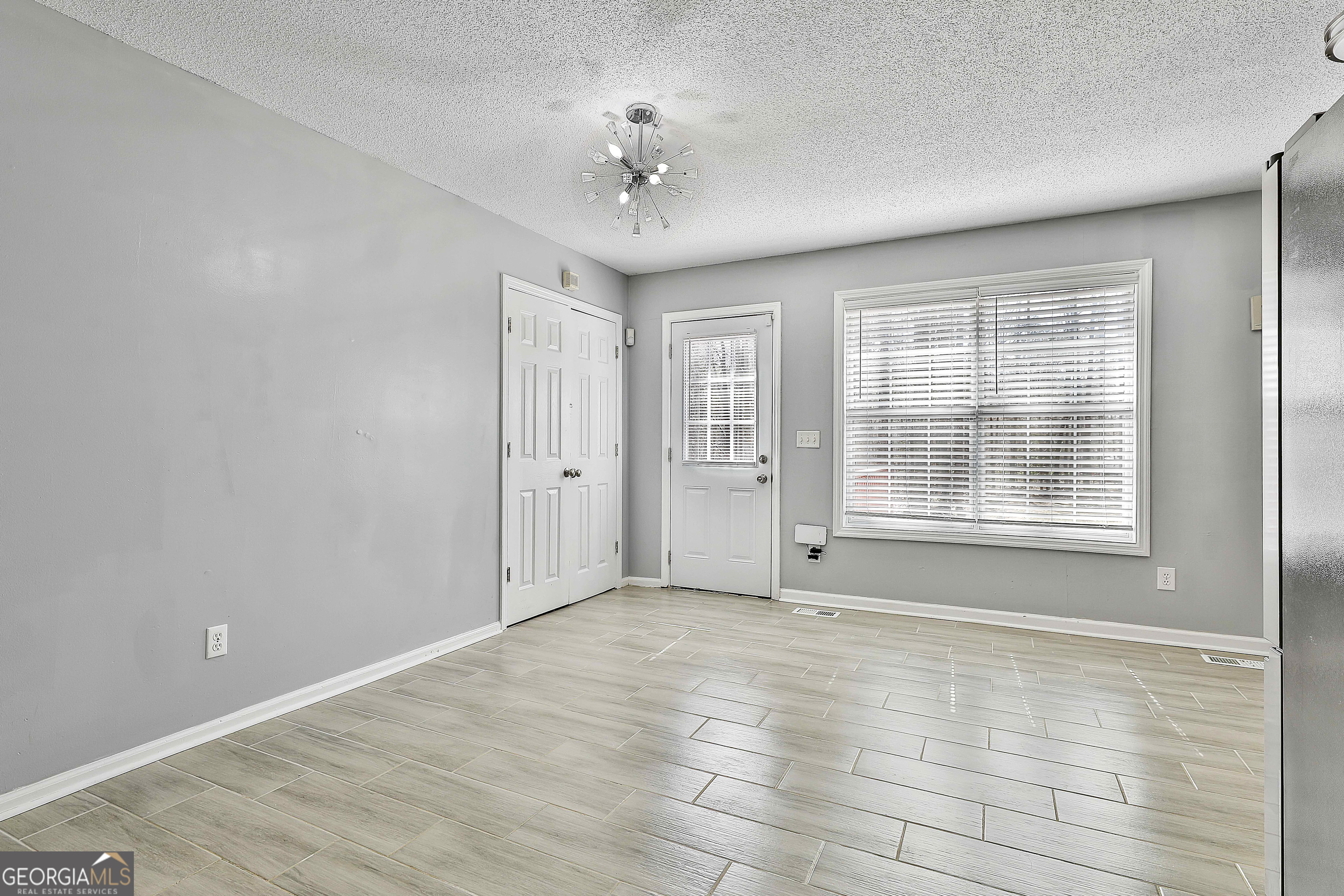 1209 North Hampton Drive Hampton, GA 30228 - Photo 13 of 39 a view of an empty room with a window