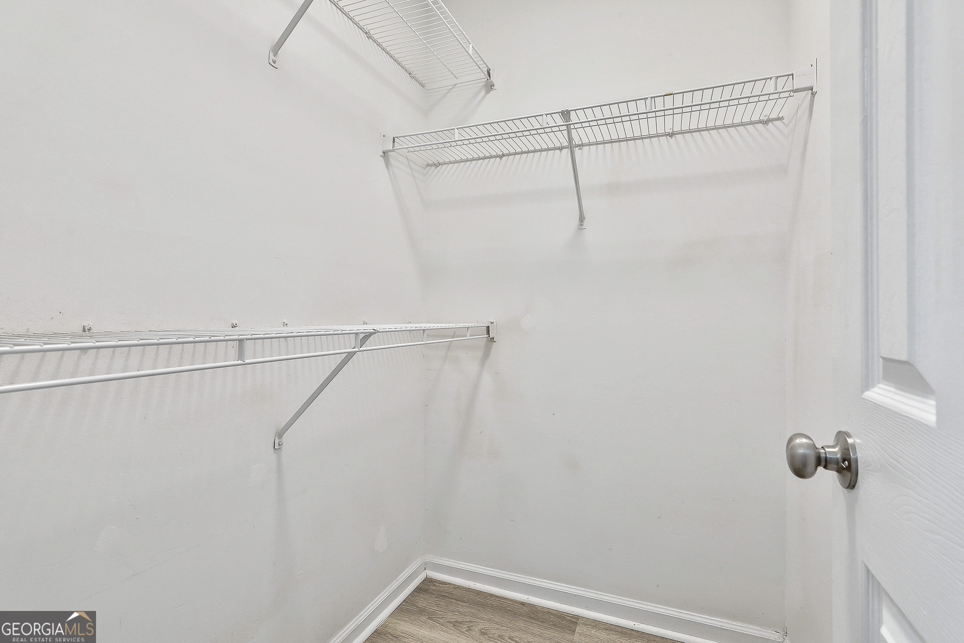 1209 North Hampton Drive Hampton, GA 30228 - Photo 23 of 39 a view of a room with racks on the wall