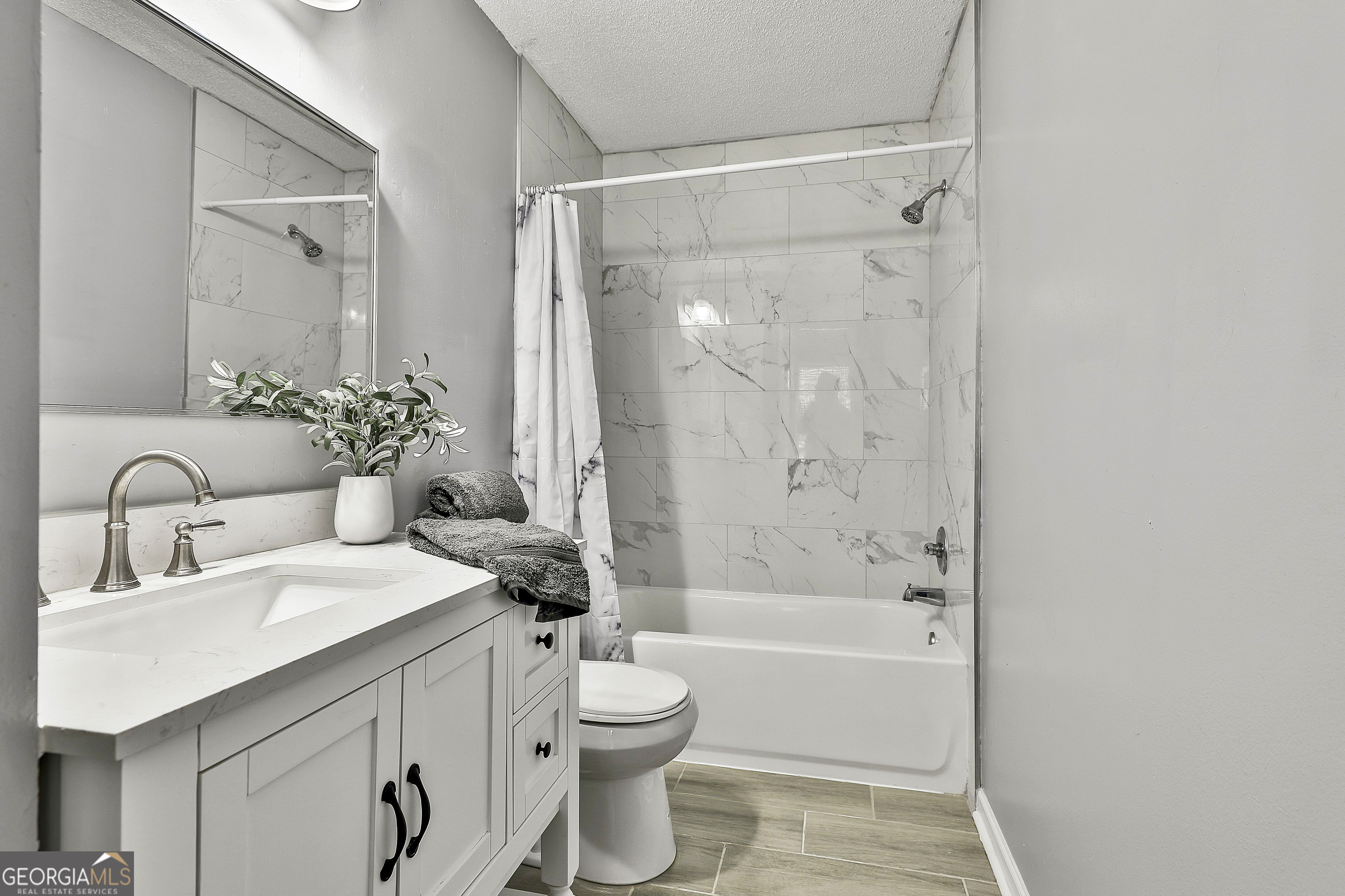 1209 North Hampton Drive Hampton, GA 30228 - Photo 25 of 39 a bathroom with a bathtub shower sink mirror and toilet