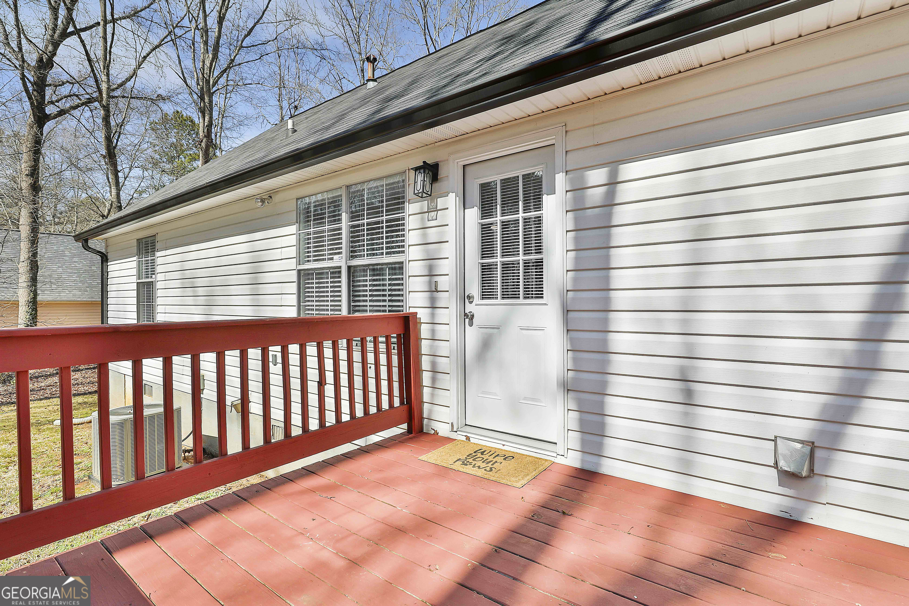 1209 North Hampton Drive Hampton, GA 30228 - Photo 28 of 39 a view of a porch with a bench