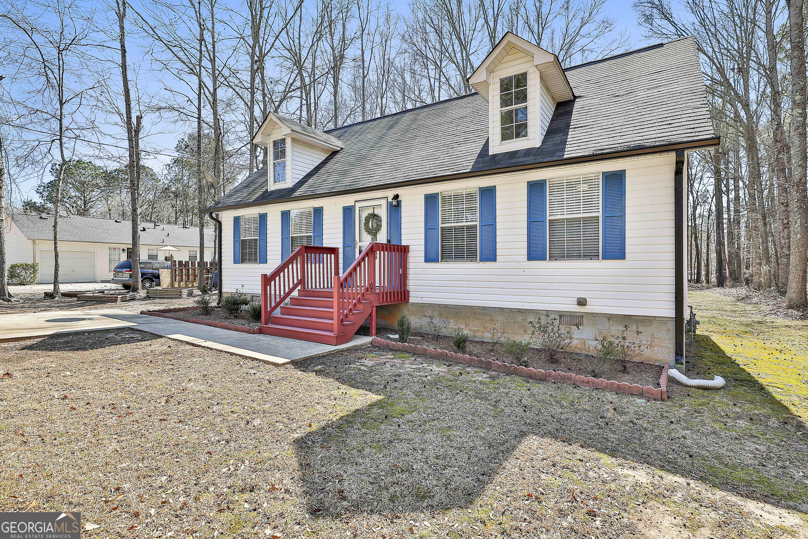 1209 North Hampton Drive Hampton, GA 30228 - Photo 3 of 39 a view of a house with a yard