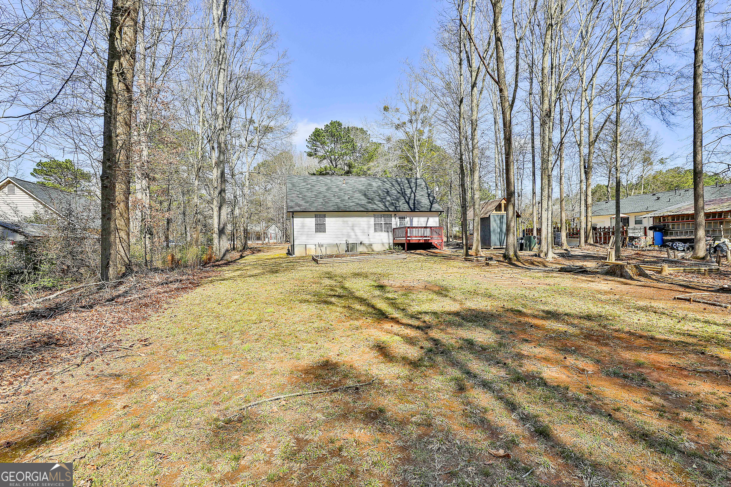 1209 North Hampton Drive Hampton, GA 30228 - Photo 33 of 39 a view of a yard with trees