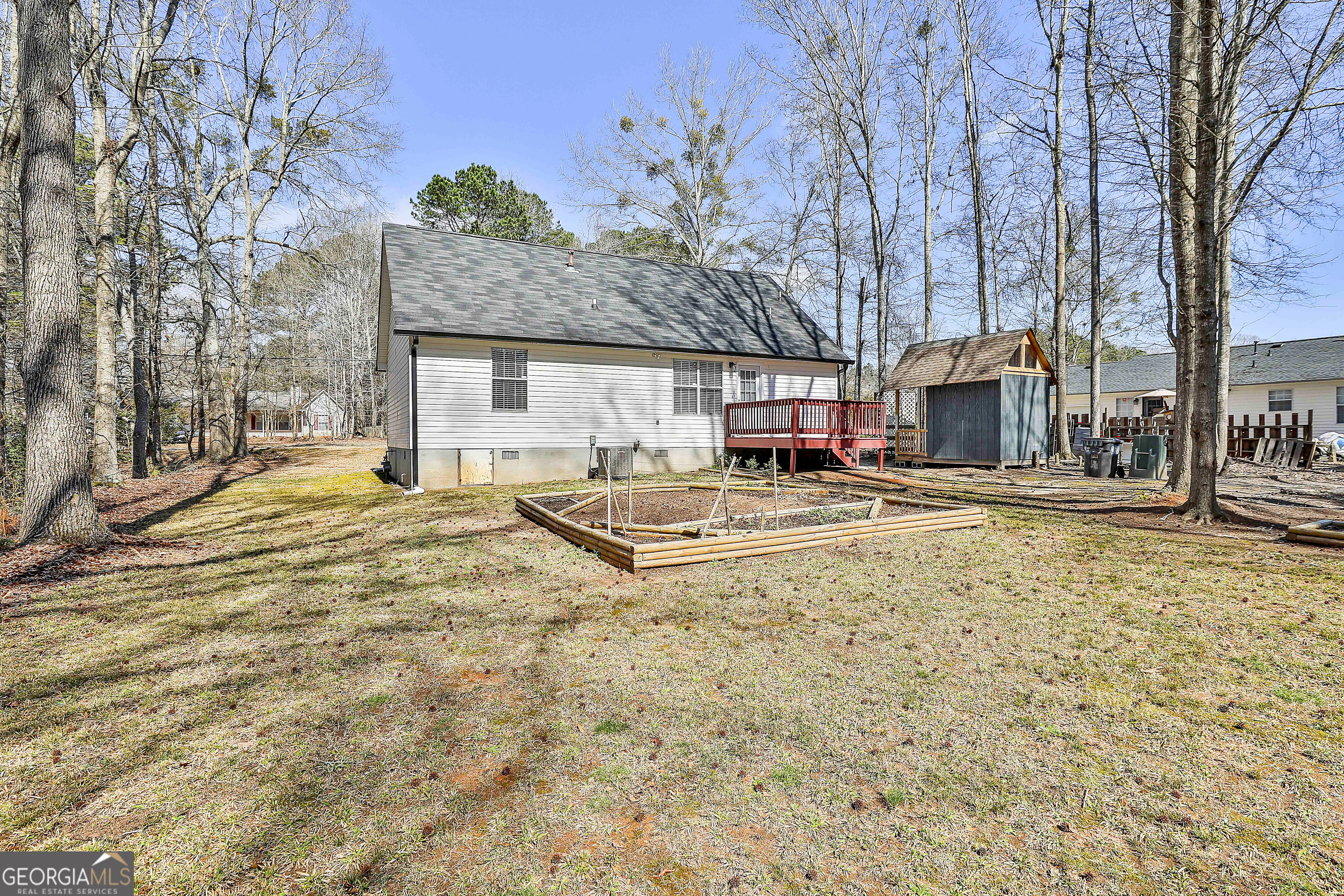 1209 North Hampton Drive Hampton, GA 30228 - Photo 34 of 39 a view of swimming pool with outdoor seating and covered with trees