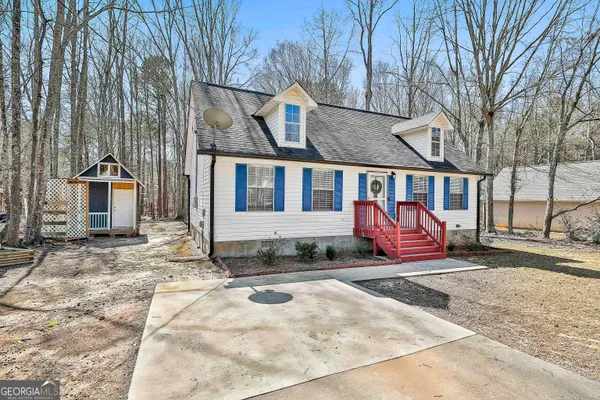 a view of a house with wooden floor in front of house
