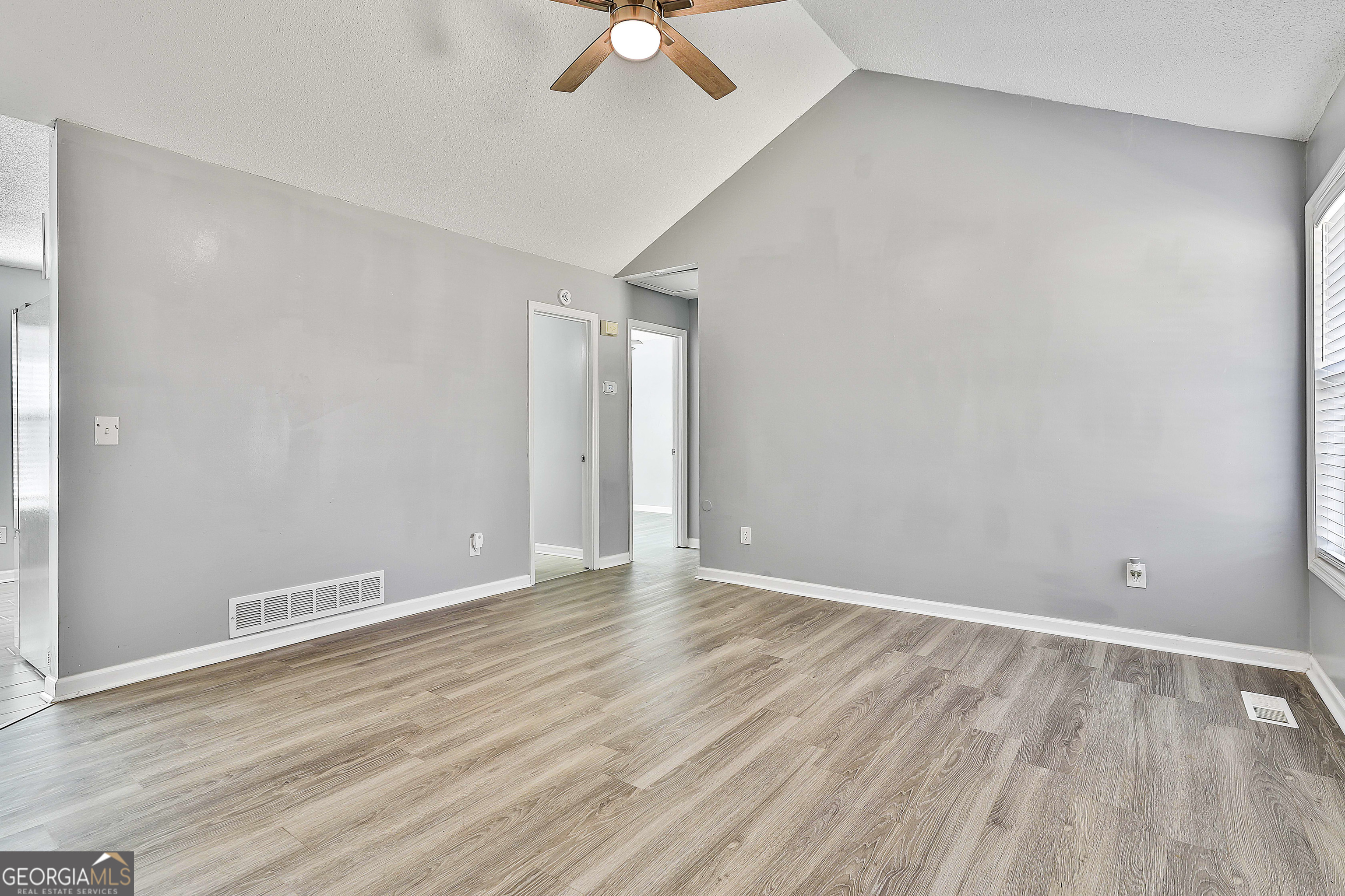 1209 North Hampton Drive Hampton, GA 30228 - Photo 8 of 39 wooden floor in an empty room