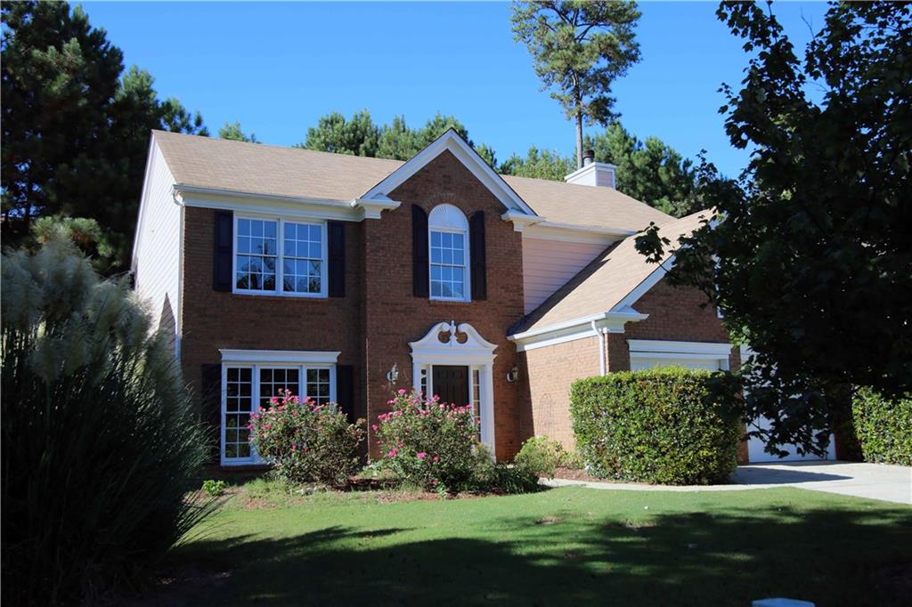 Beautiful brick front home in popular swim/tennis community.