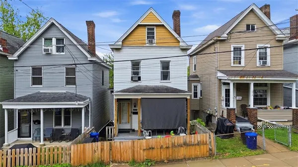 a front view of a house with a porch
