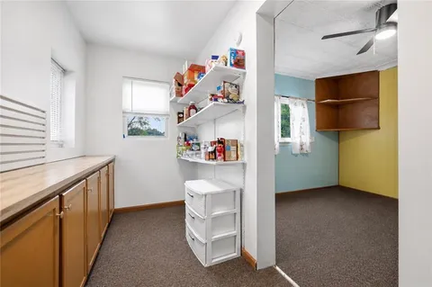 a room with cabinets and a window