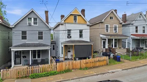 a front view of a house with a porch