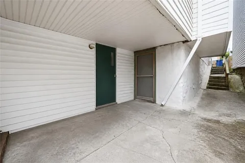 a view of an empty room with stairs