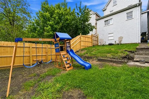 a view of a backyard with a small house