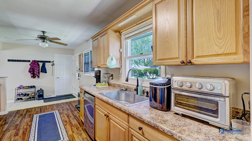 319 Croyden Street Spring Grove, IL 60081 - Photo 13 of 42 a kitchen with a sink and a stove top oven
