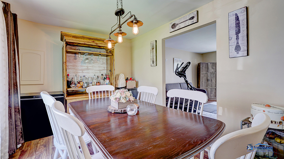 319 Croyden Street Spring Grove, IL 60081 - Photo 15 of 42 a dining room with furniture a chandelier and wooden floor