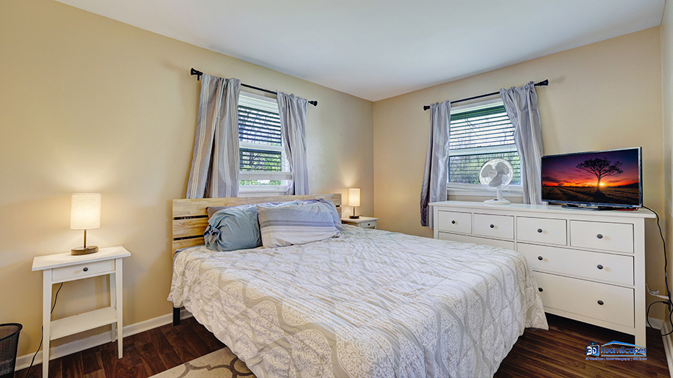 319 Croyden Street Spring Grove, IL 60081 - Photo 18 of 42 a bedroom with a bed and a flat screen tv