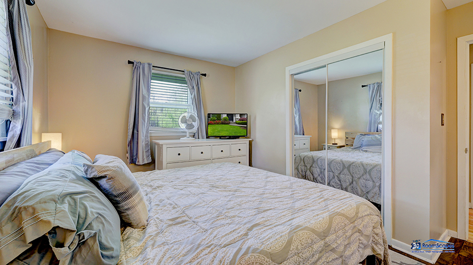 319 Croyden Street Spring Grove, IL 60081 - Photo 19 of 42 a bedroom with a bed and a large mirror