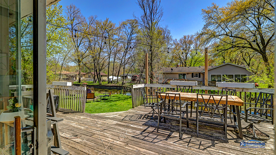 319 Croyden Street Spring Grove, IL 60081 - Photo 2 of 42 a front view of a house with garden and sitting area