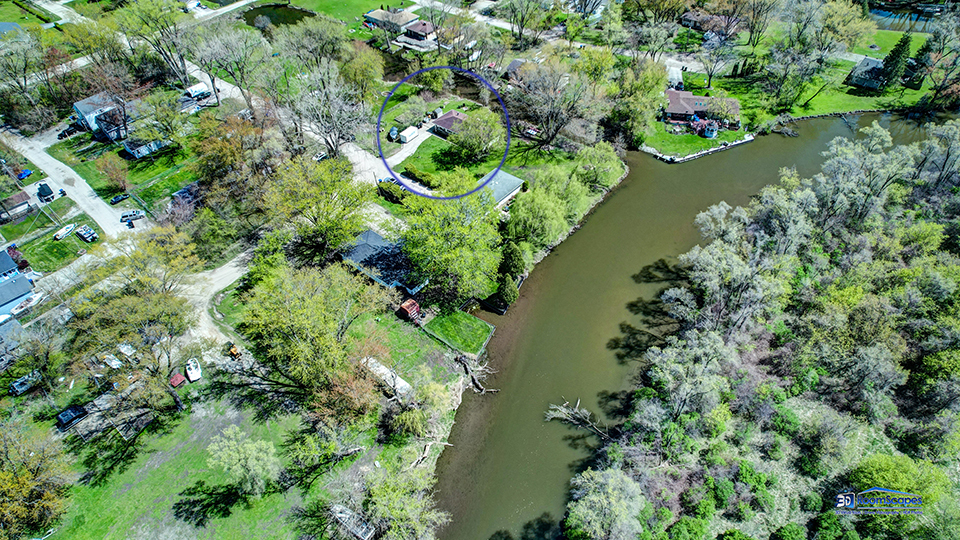319 Croyden Street Spring Grove, IL 60081 - Photo 37 of 42 an aerial view of a house with a yard and lake view