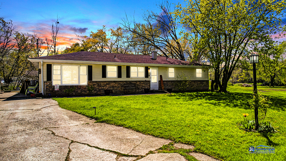 319 Croyden Street Spring Grove, IL 60081 - Photo 42 of 42 a front view of a house with a yard and trees