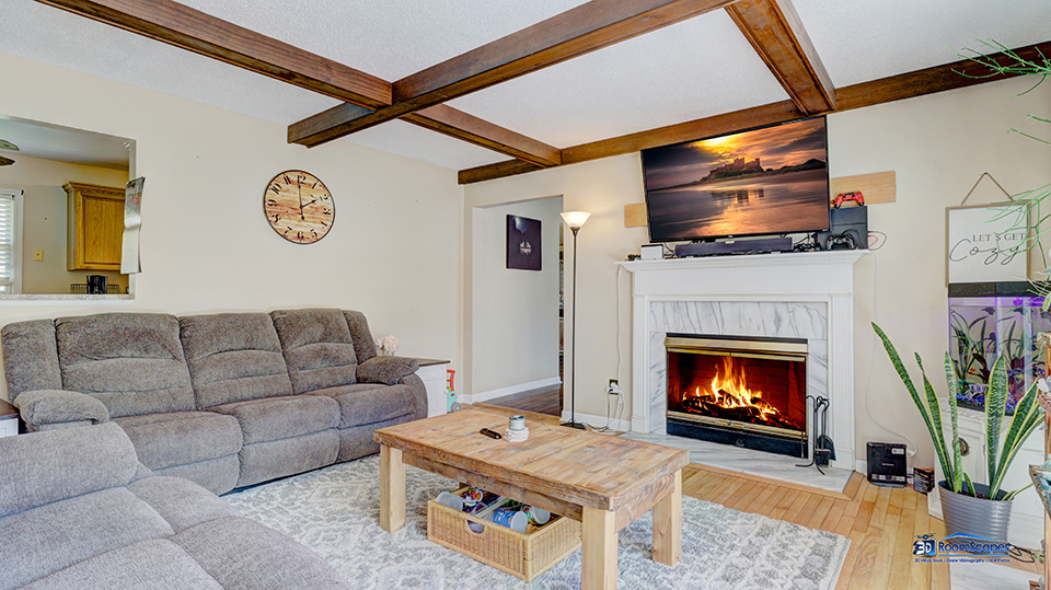 319 Croyden Street Spring Grove, IL 60081 - Photo 6 of 42 a living room with furniture a flat screen tv and a fireplace