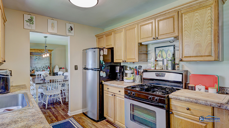 319 Croyden Street Spring Grove, IL 60081 - Photo 10 of 42 a kitchen with stainless steel appliances granite countertop a stove refrigerator and cabinets