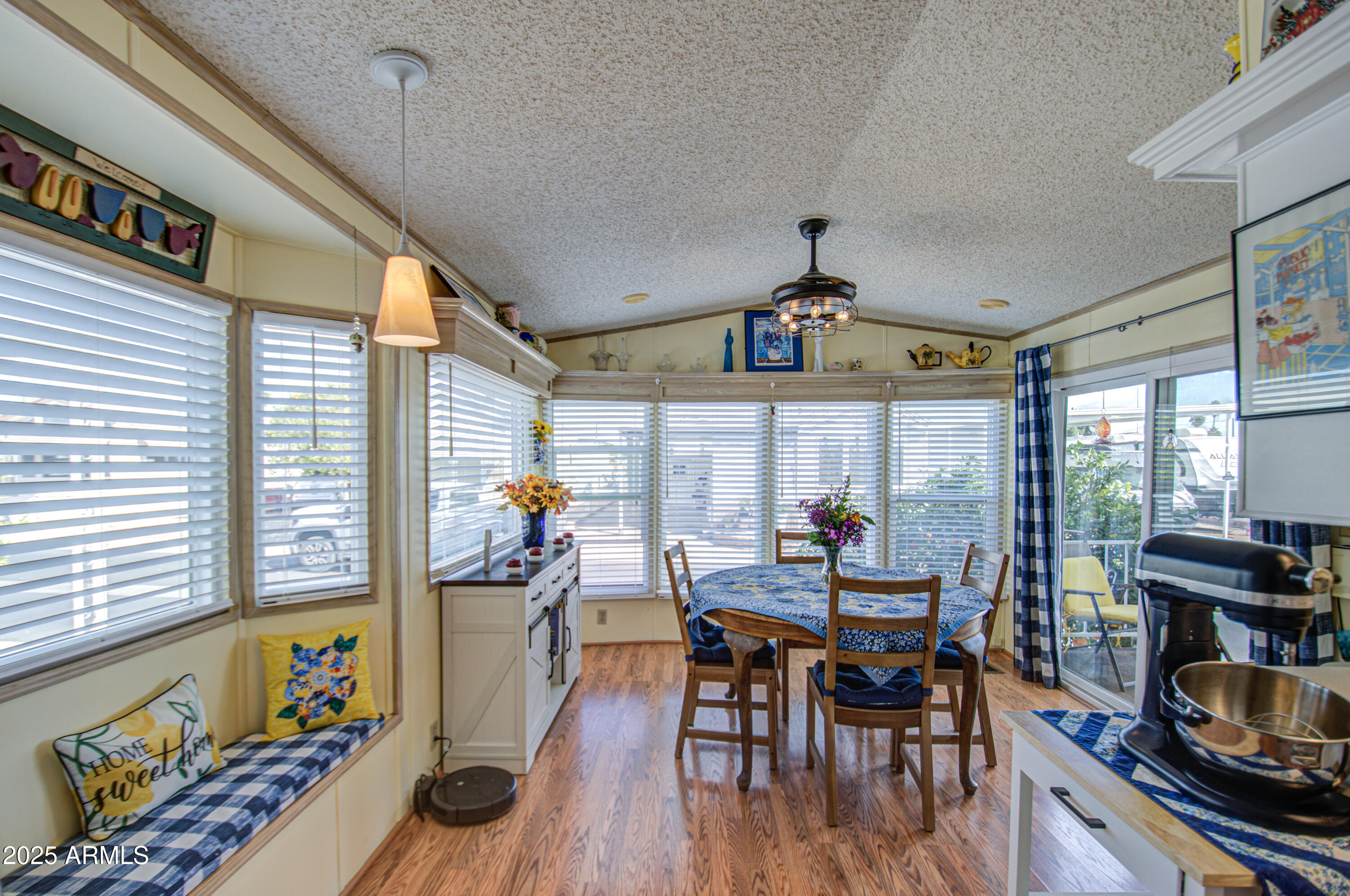 7750 East Broadway Road, Unit 475 Mesa, AZ 85208 - Photo 11 of 34 a view of a dining room with furniture window and outside view