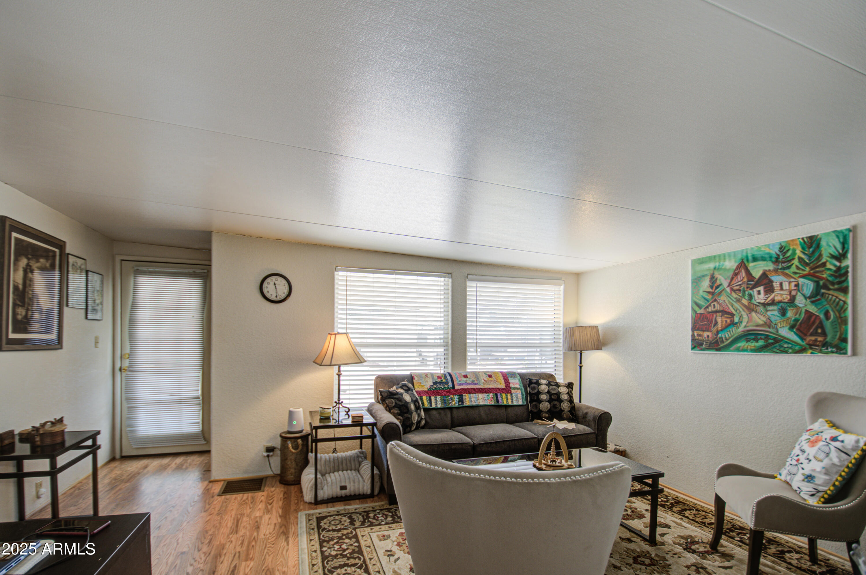7750 East Broadway Road, Unit 475 Mesa, AZ 85208 - Photo 17 of 34 a living room with furniture a window and a potted plant