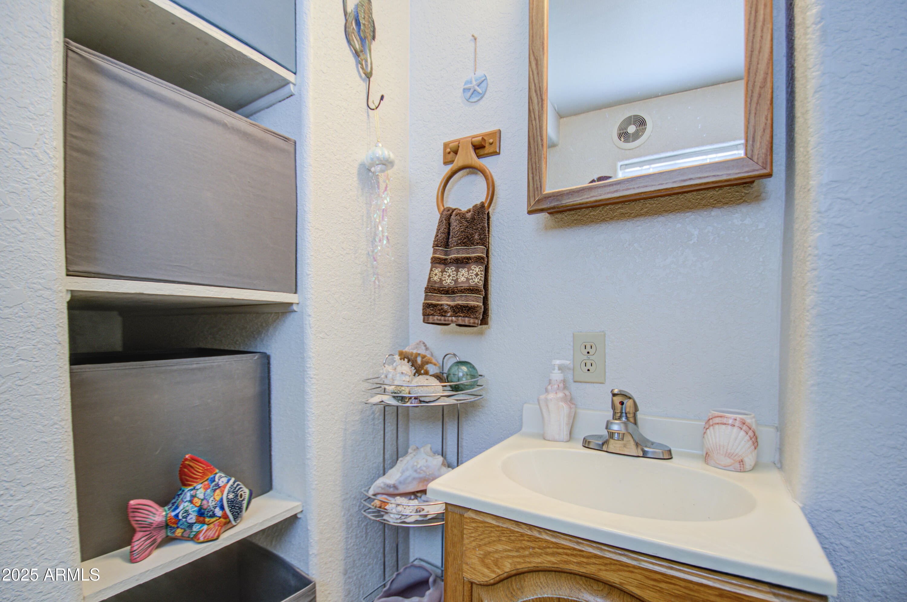 7750 East Broadway Road, Unit 475 Mesa, AZ 85208 - Photo 19 of 34 a bathroom with a sink and a mirror