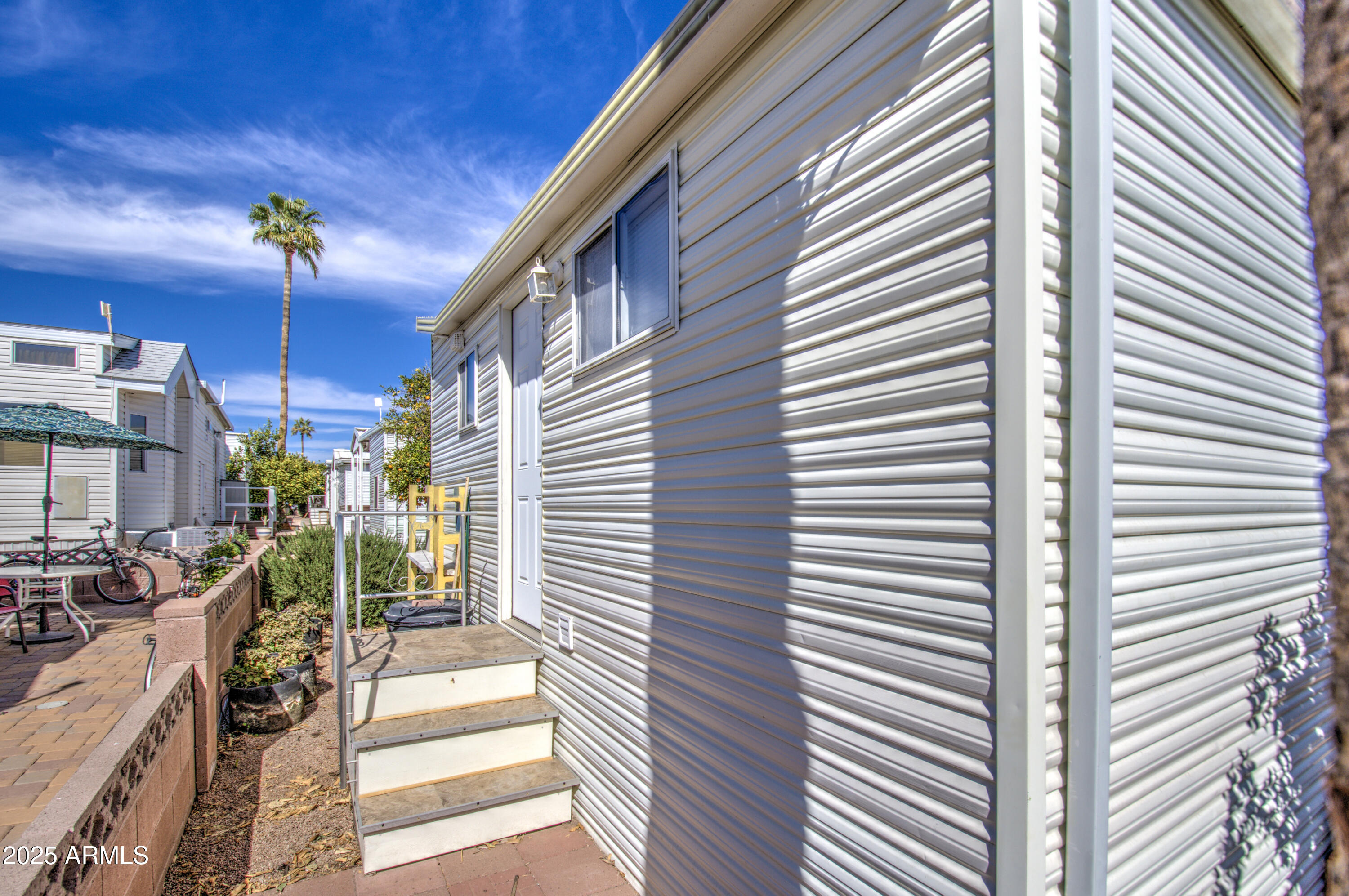 7750 East Broadway Road, Unit 475 Mesa, AZ 85208 - Photo 21 of 34 a view of a balcony with furniture