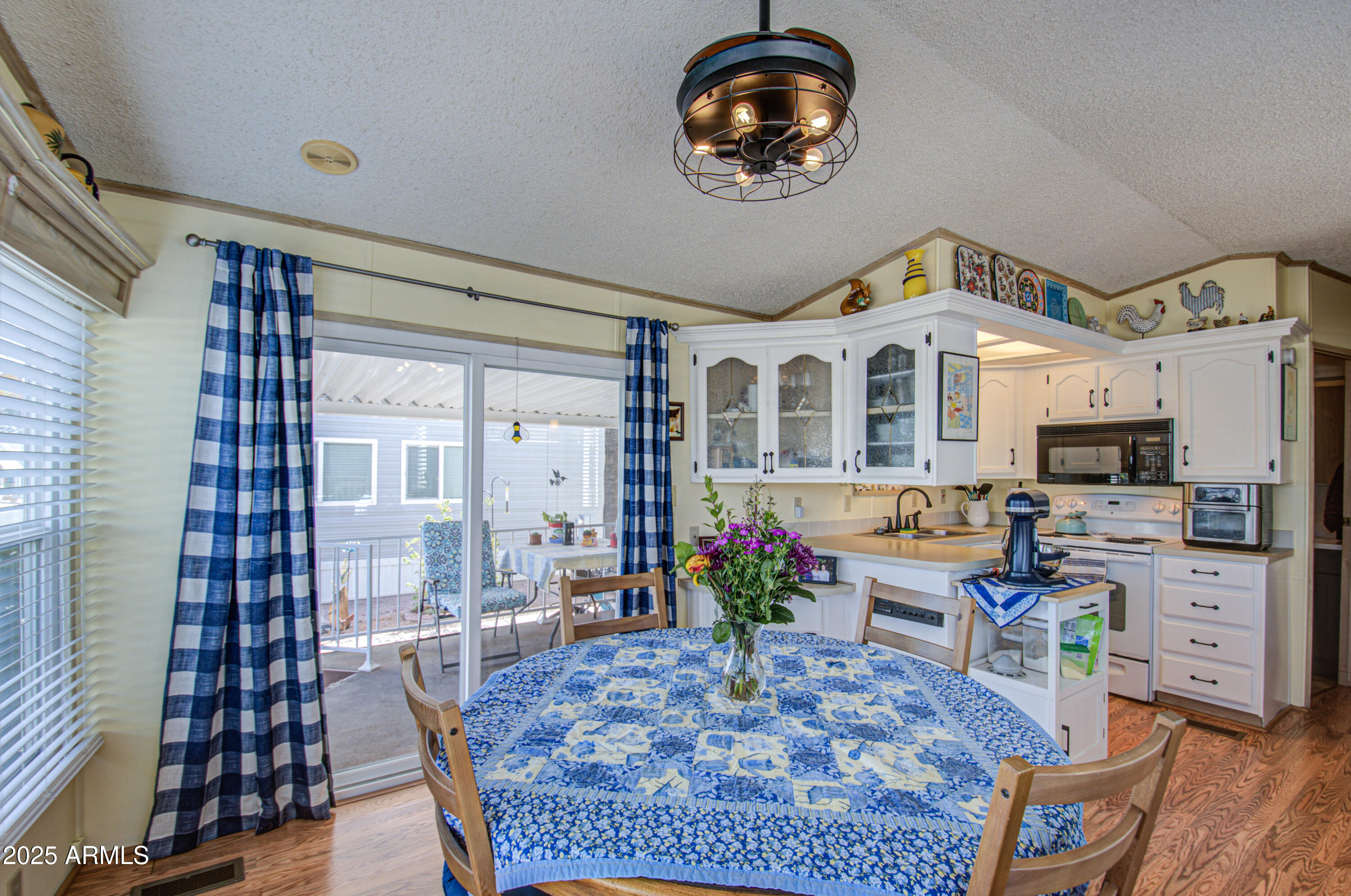 7750 East Broadway Road, Unit 475 Mesa, AZ 85208 - Photo 8 of 34 a living room with furniture a rug and a large window