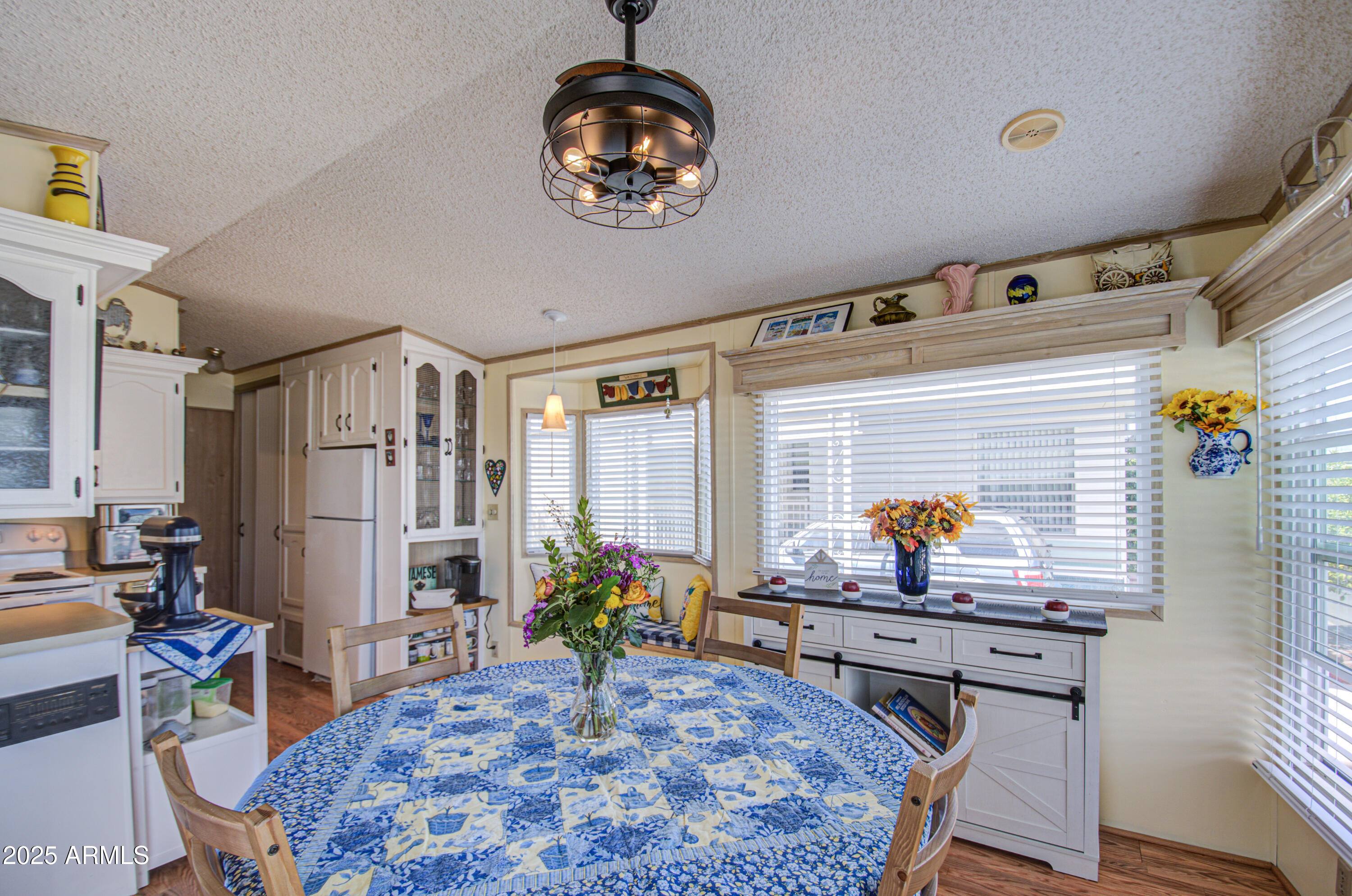 7750 East Broadway Road, Unit 475 Mesa, AZ 85208 - Photo 9 of 34 a room with furniture and window