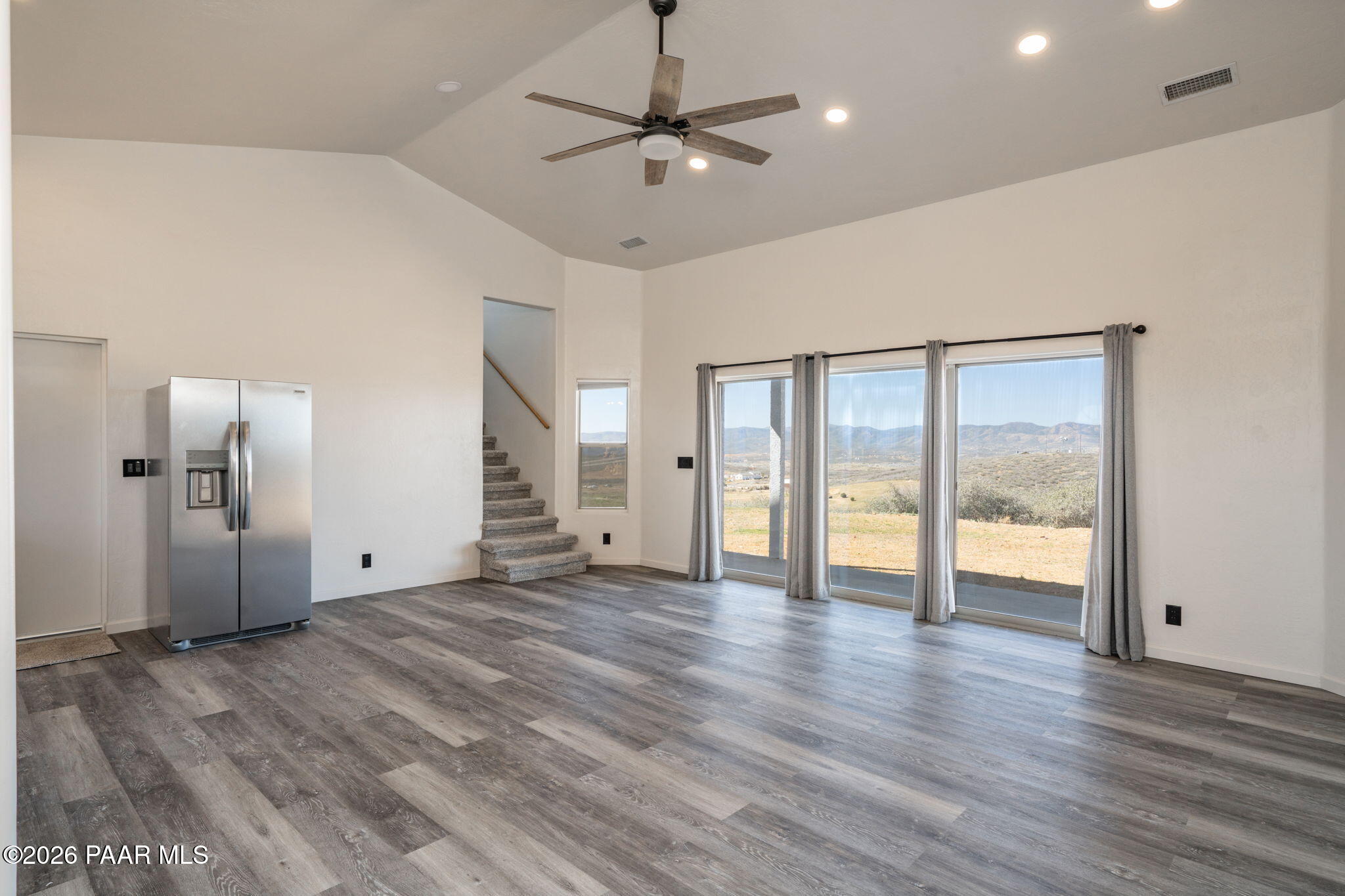 16751 Leprechaun Road Dewey, AZ 86327 - Photo 12 of 46 a view of an empty room with window and wooden floor