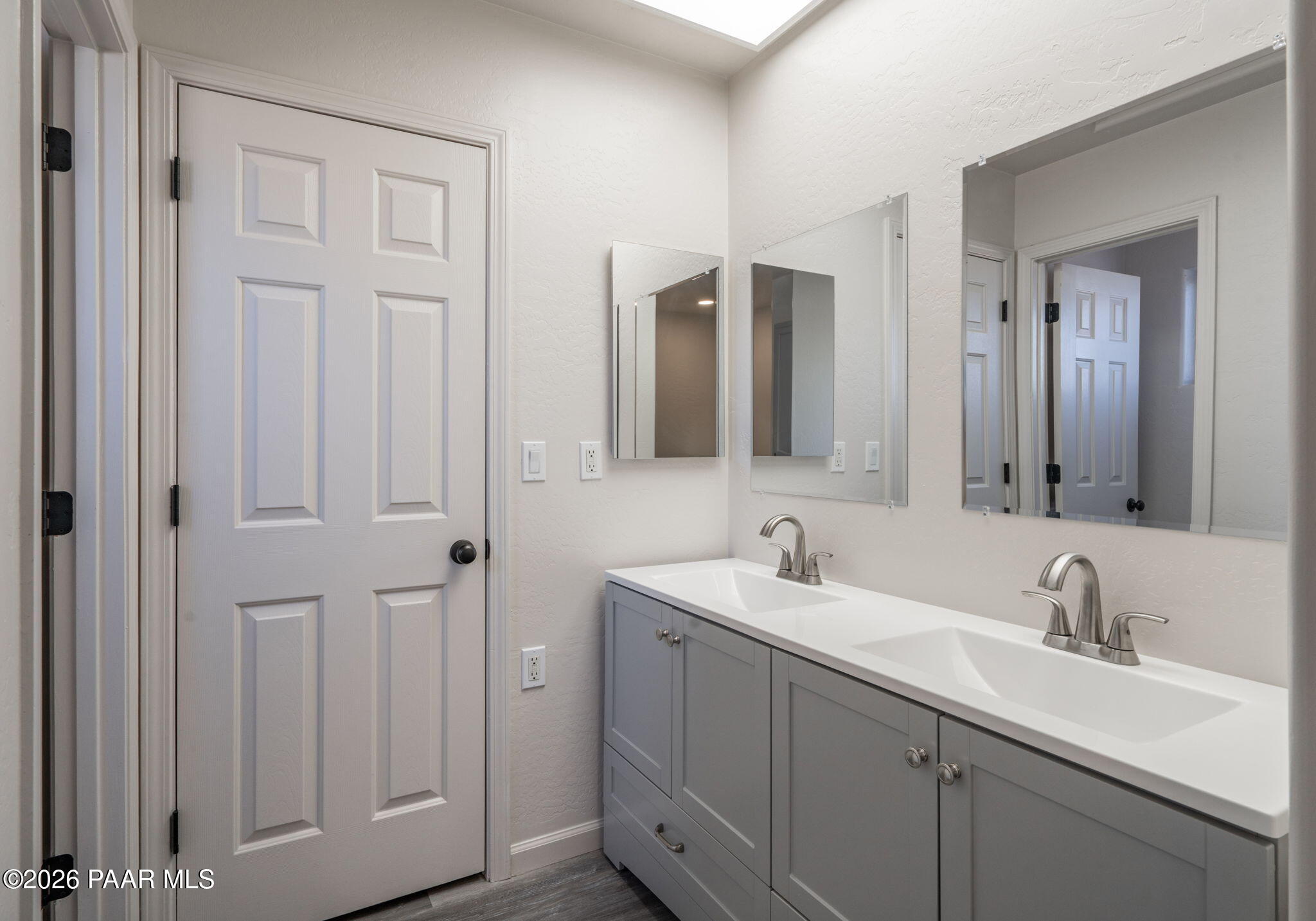 16751 Leprechaun Road Dewey, AZ 86327 - Photo 21 of 46 a bathroom with double vanity sinks and a mirror
