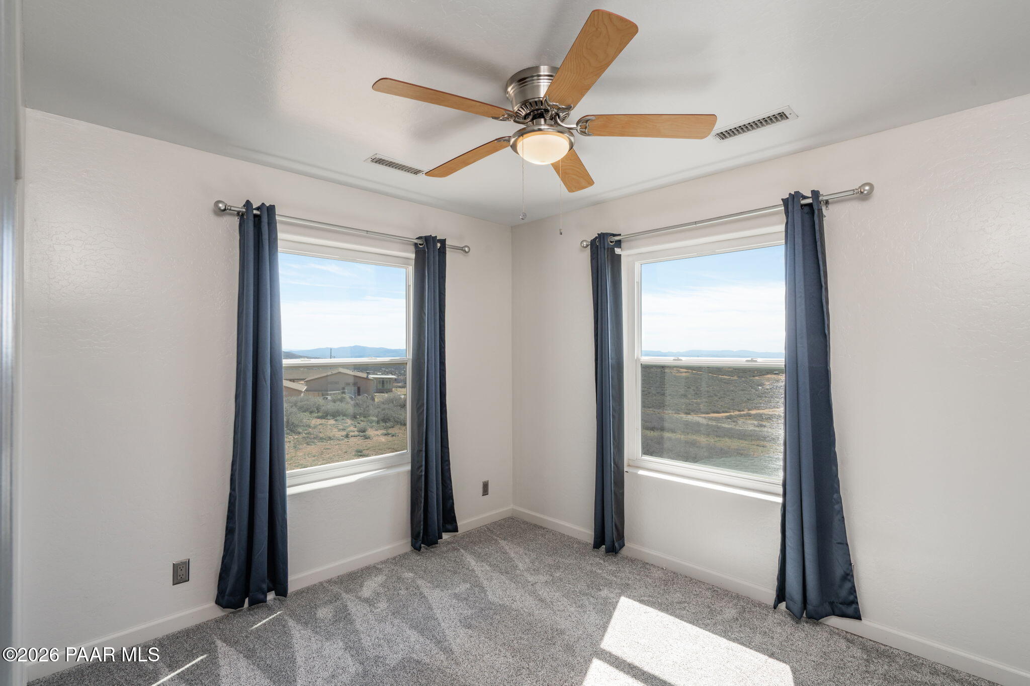 16751 Leprechaun Road Dewey, AZ 86327 - Photo 26 of 46 a view of a livingroom with a ceiling fan and window