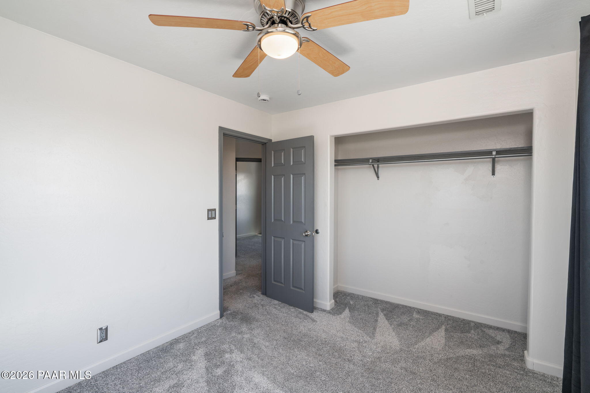 16751 Leprechaun Road Dewey, AZ 86327 - Photo 31 of 46 an empty room with a ceiling fan and a fan