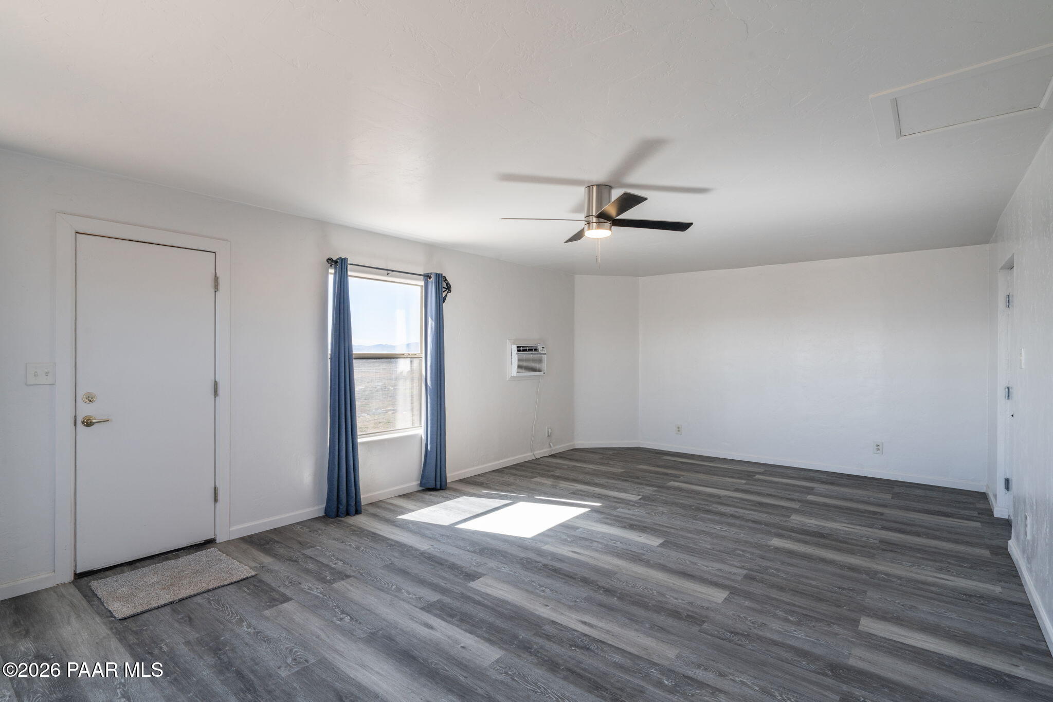 16751 Leprechaun Road Dewey, AZ 86327 - Photo 32 of 46 a view of empty room with wooden floor and fan