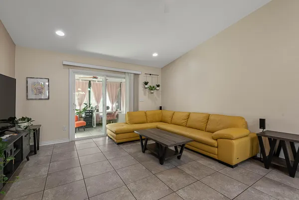 a view of a dining room with furniture and a chandelier