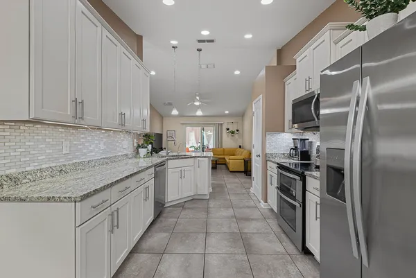 a kitchen with sink and cabinets