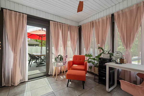 a front view of a house with a garden and yard