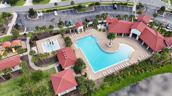 an aerial view of a house with a lake view