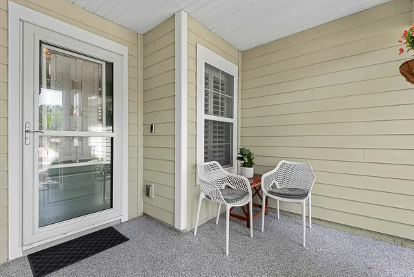 a backyard of a house with outdoor seating
