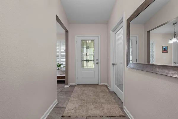 a kitchen with a refrigerator and a sink