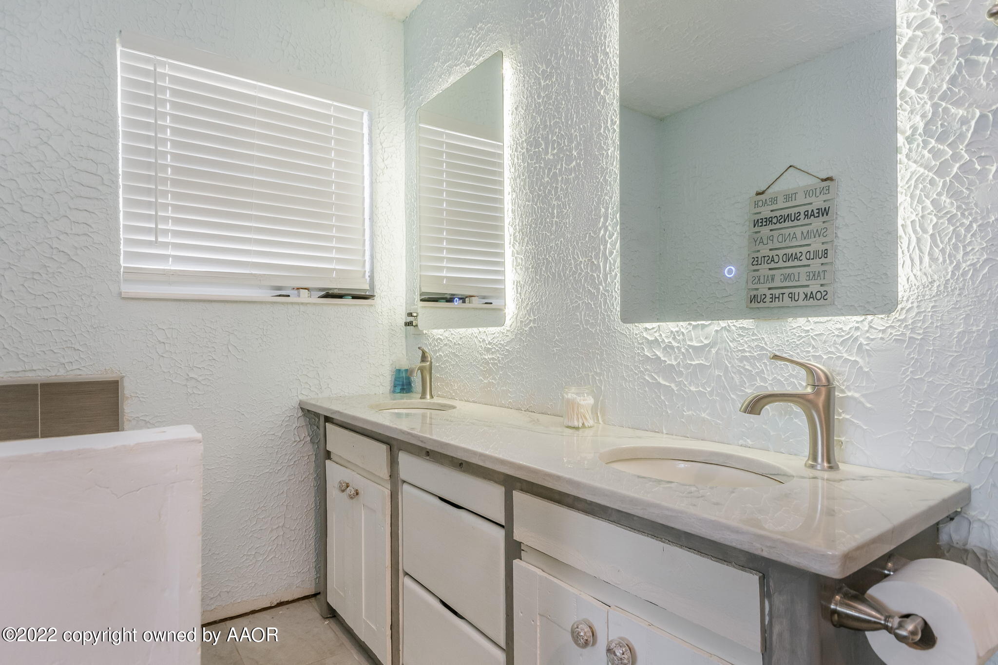 4801 Gary Lane Amarillo, TX 79110 - Photo 11 of 21 a bathroom with a sink and a window