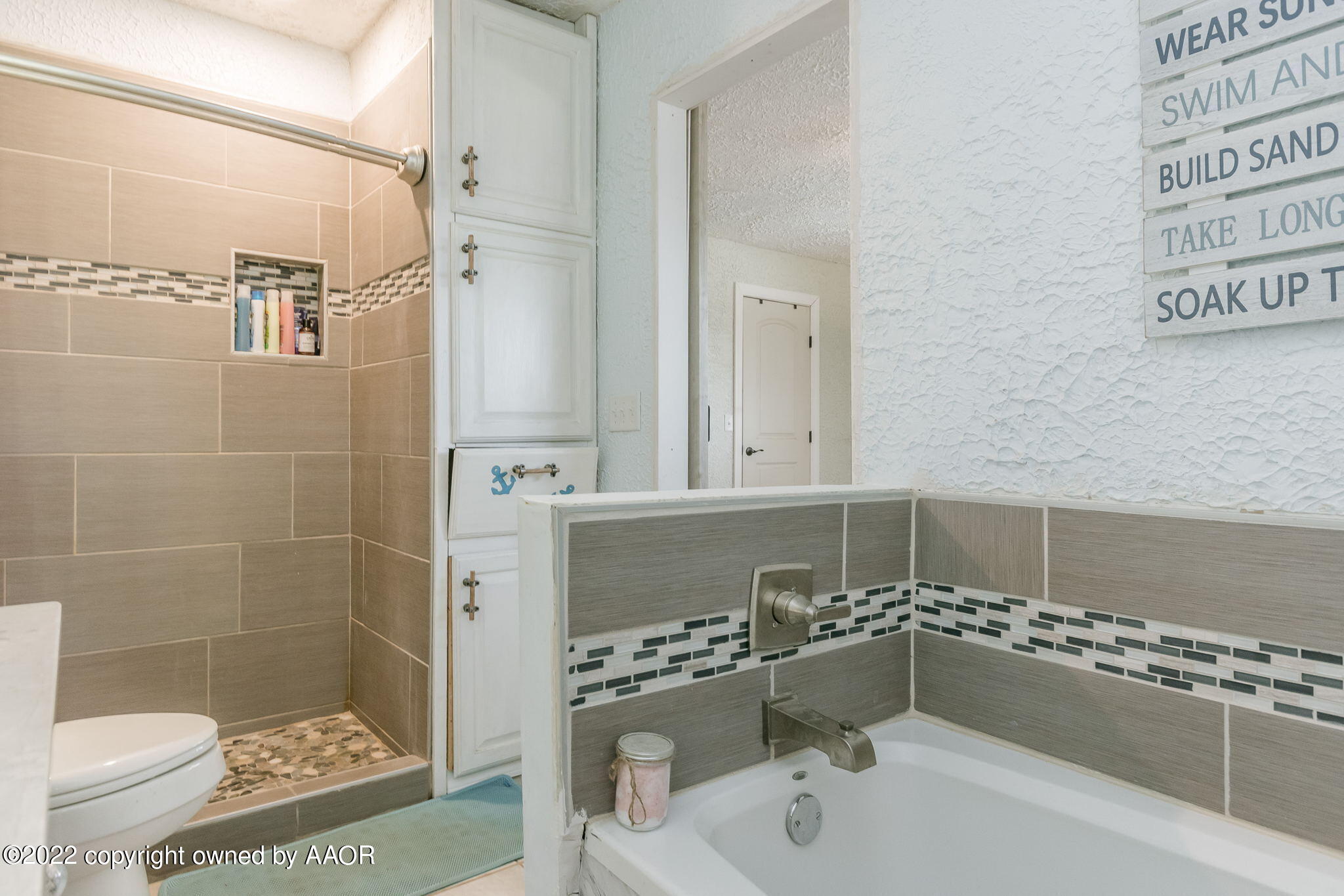 4801 Gary Lane Amarillo, TX 79110 - Photo 12 of 21 a bathroom with a bathtub and a shower