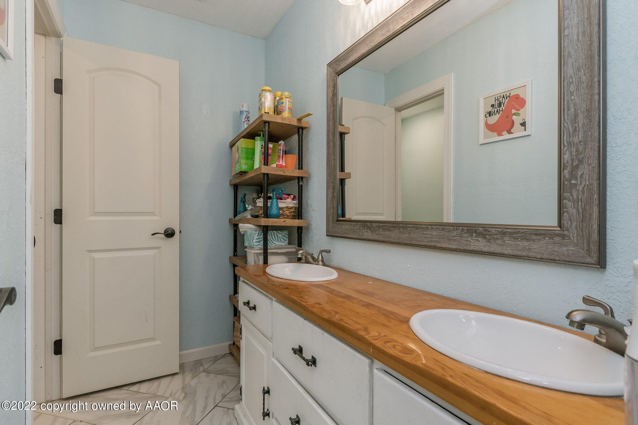 4801 Gary Lane Amarillo, TX 79110 - Photo 14 of 21 a bathroom with a sink and a mirror