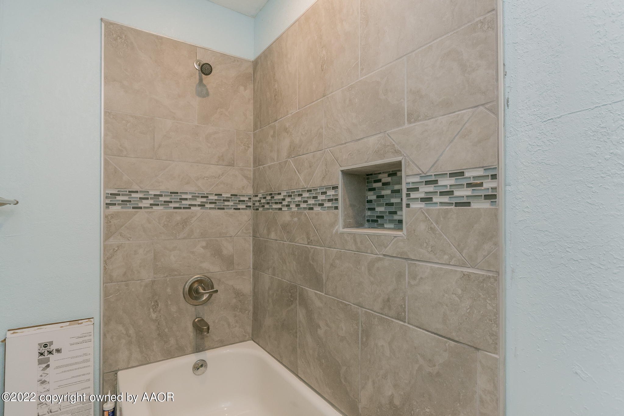 4801 Gary Lane Amarillo, TX 79110 - Photo 15 of 21 a bathroom with a bathtub and shower