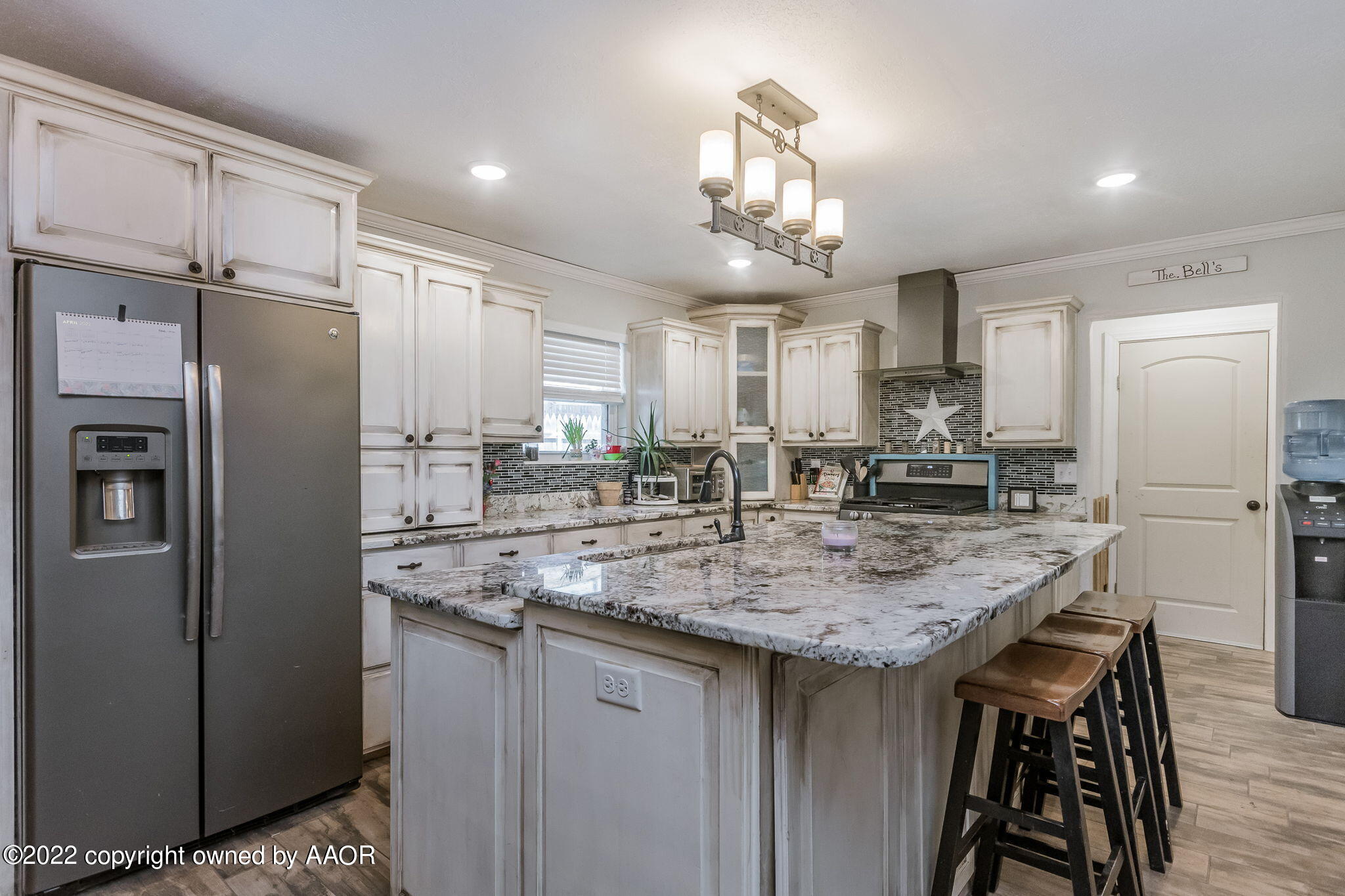 4801 Gary Lane Amarillo, TX 79110 - Photo 5 of 21 a kitchen with stainless steel appliances granite countertop a sink refrigerator and cabinets