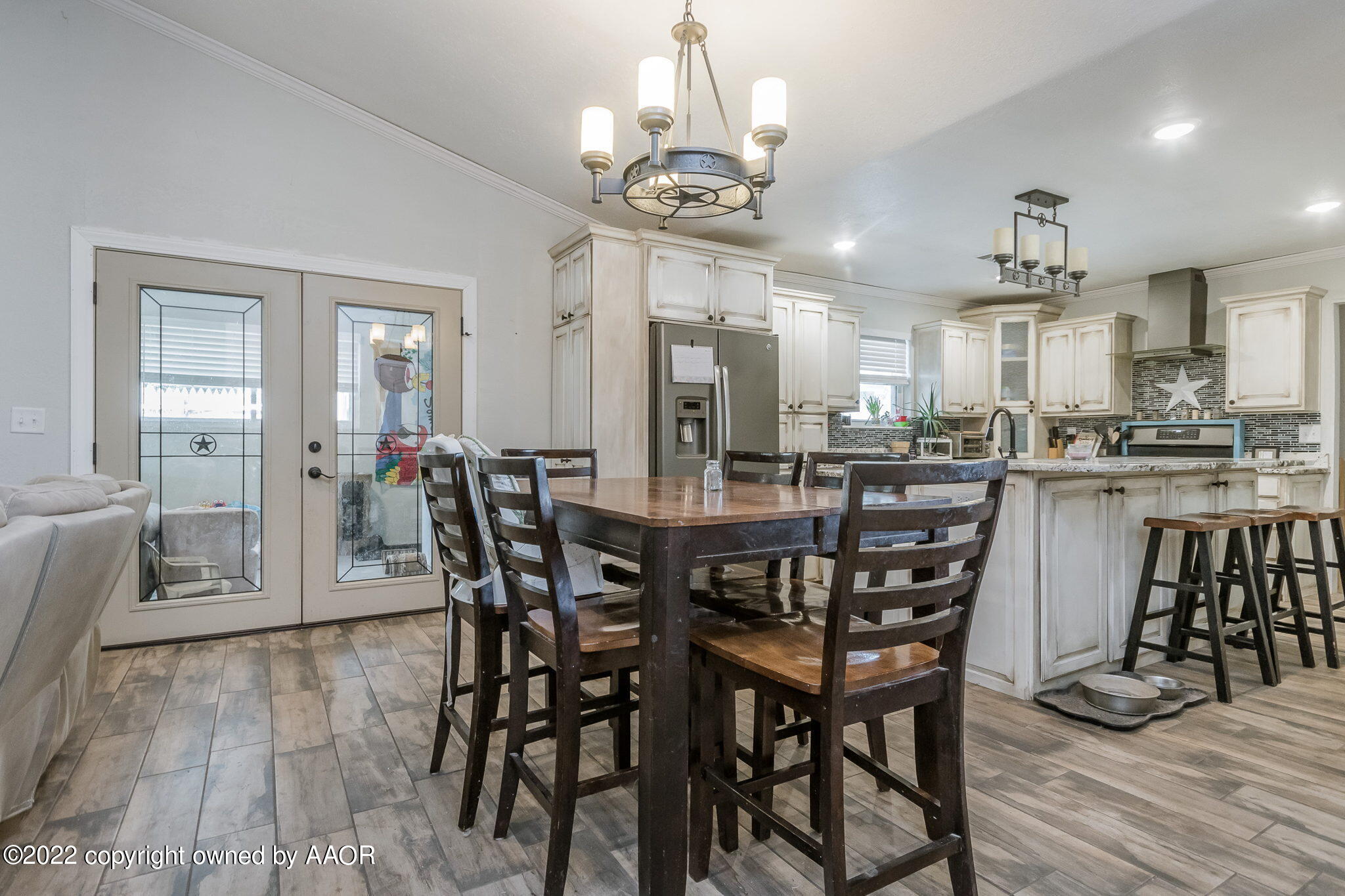 4801 Gary Lane Amarillo, TX 79110 - Photo 8 of 21 a view of a dining room with furniture and wooden floor