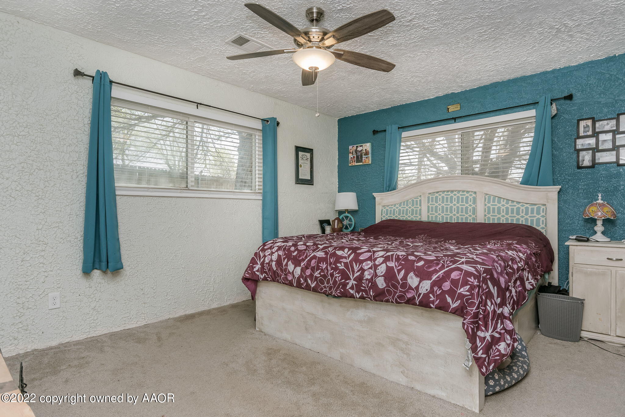 4801 Gary Lane Amarillo, TX 79110 - Photo 9 of 21 a bedroom with a bed and window